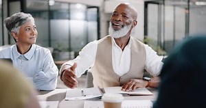 Senior black man, handshake and business meeting for hr recruitment, hiring and interview success in creative office. Teamwork, partnership agreement and growth leadership, shaking hands and success
