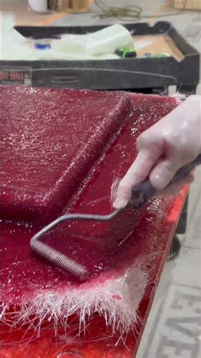 Rolling out the handlaid fiberglass #NuWaveComposites #HandLayup #Fiberglass #CompositeManufacturing