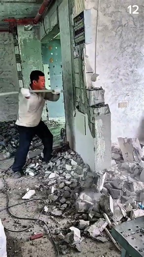 Wall breaks—morning rhythm strikes crisp rubble in crowbar swing and dust breath