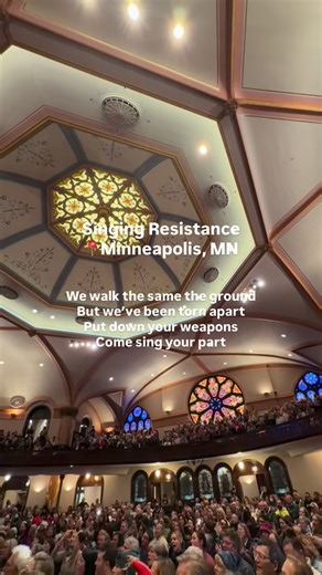 Singing resistance, moments before taking to the streets to walk together in downtown Minneapolis to the hotels where ICE agents are housed, where they will invite them, nonviolently, to defect from their posts and join us in solidarity. An offering rooted in compassion and collective humanity. On a personal note, I am absolutely in awe. This is one of the most extraordinary uses of music I have witnessed in all my years as an activist and social justice songwriter. #singingresistance | Heather 