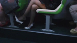 Lady dangling her high heels...