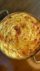 Gratin Dauphinois 500g peeled and sliced yellow potato 2 cups heavy cream 1/2 bunch thyme 2 cloves garlic crushed 1/2tsp grated nutmeg 1 shallot sliced 5 2 oz grated Gruyère 4Tbsp butter 1Tbsp salt 1 whole egg -Combine cream, salt, thyme, garlic, butter, shallot, nutmeg. Bring to a boil. Turn off the heat and cover. -Let steep 30 minutes. -Strain cream mixture over sliced potato -Add 5oz Gruyère and mix well. -Add egg and mix well -Layer potatoes as desired. Cover with remaining cream until almo