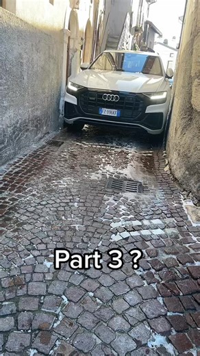 Exploring a Historic Alley with a White Audi SUV