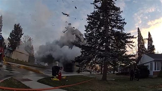 Garbage truck explodes in flame and spews debris