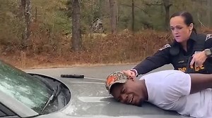 Shocking moment female cop tasers black man in handcuffs repeatedly