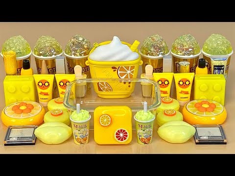 YELLOW SLIME. Mixing makeup and glitter into Clear Slime. ASMR Satisfying Slime Videos 1080p.