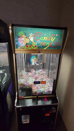Exploring an Old Candy Claw Machine at a Rest Stop