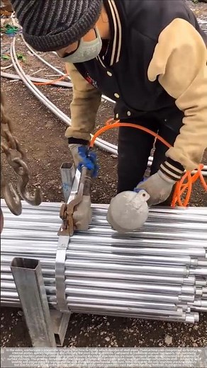 Pneumatic strapping machine in action: securing a bundle of steel pipes in just a few seconds.