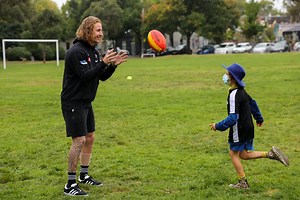 Beau McCreery and Josh Carmichael assist an afterschool FASTA football clinic at the Fitzroy housing estates as part of Cultural Diversity Week 🙌 | Collingwood Football Club