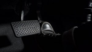 Accelerate and Brake. Foot pressing foot pedal of a car to drive ahead. Accelerator and brake pedal in a car. Driver driving the car by pushing accelerator pedals of the car. inside vehicle automobile
