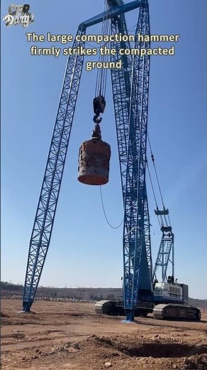 The large compaction hammer firmly strikes the compacted ground