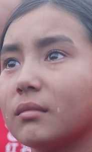 868K views · 38K reactions | Tears welled up in her eyes, as a student from China's Xinjiang watched the national flag-raising ceremony in the heart of Beijing. #Xinjiang #TouchingMoment | China Xinhua News | Facebook