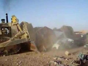 Armored D9 Dozer crushing cars in Iraq