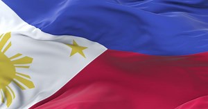 Philippines flag waving at wind in slow with blue sky, loop