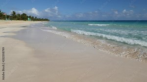 Tracking shot of gentle waves slapping against the white sandy stretch of Flamingo Beach in Culebra, Puerto Rico, with wave sounds. Flamingo is one of the most beautiful beaches in the Caribbean.