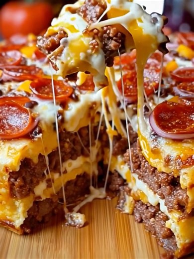 Ultimate Stuffed Layered Pizza Pie A towering pizza bake with stacked layers of cheese, meat, and pepperoni. Yield: 10–12 slices Temp: 375°F (190°C) Time: 1 hour Key Ingredients First: Pizza dough ................................. Full Recipe in First Cօʍʍеոτ 👇 | Recipes by Mamas