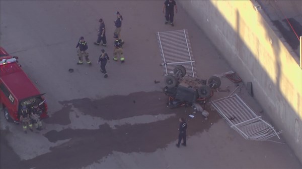 ATV crashes through gate, lands upside down in dry canal; 2 teens critically injured