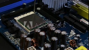 Technician plug in CPU Chip Microprocessor to motherboard socket. Stock Video