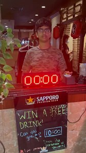 Me winning a free beer by stopping the timer at exactly 10 seconds