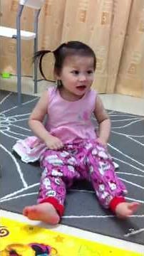27 months toddler wearing pants by her self