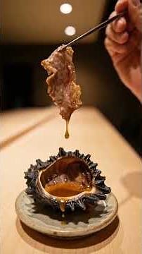 The wrong thing to do when eating grilled turban shells: tearing off the liver and the perfect wa...