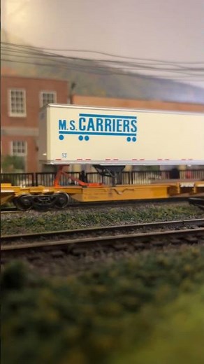 Conrail’s TV-37 takes the Marcusville main through the shopping district.