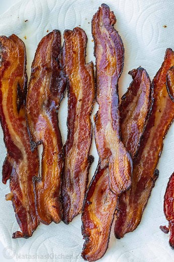 Learn how to bake bacon in just a few simple steps! 🥓 Recipe; https://natashaskitchen.com/baked-bacon-recipe/ | NatashasKitchen.com
