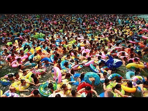 Thousands cram into Chinese swimming pool during heatwave