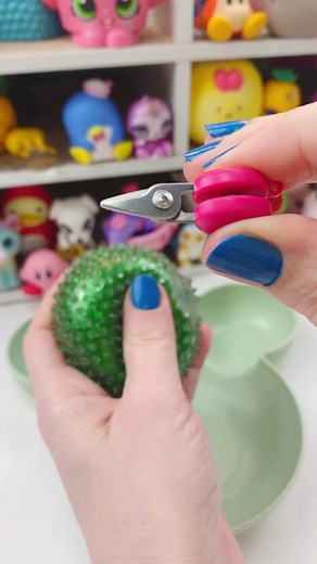 Can the world’s smallest scissors cut open a squishy? Please do not use water beads around small children or pets. #worldssmallest #tiny #tinyscissors #squishy #doctorsquish