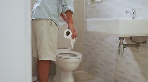 Download A man feeling his stomach with abdominal pain and use hand open the toilet lid. Men have diarrhea after waking up in the morning. Health concepts for diarrhea and gastritis. for free