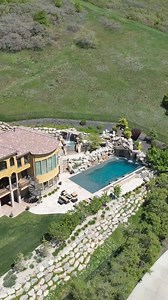 169K views · 2.4K reactions | Do you remember this pool from Season 3 of Insane Pools: Off the Deep End, Episode: Top of the Mountain? We created a Tuscan themed pool complete with a spa, the biggest linear fire wall we’ve ever built, and a grotto with a 23,000 pound lid! Video from @slcpoolservice , who does an excellent job maintaining this pool. #lucaslagoons #insanepools #pool #backyardgoals | Lucas Lagoons Design | Facebook
