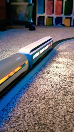 locomotive 😎 with one daylight coach and Amtrak coach and one polar express observation car.