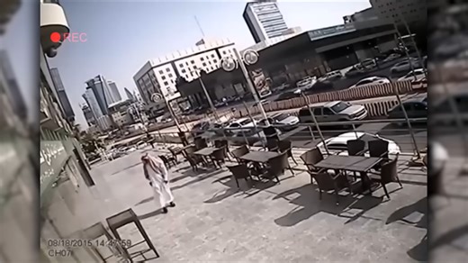 He stopped to check his shoe and glass fell from the sky inches away - Caught on camera