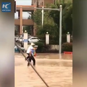36K views · 1.4K reactions | Heartwarming: A policeman gives an elderly man a piggyback ride in a flooded street in Jinhua, China | China Xinhua News | Facebook