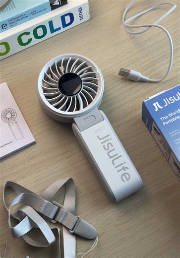 Stay cool wherever you go with the JisuLife Handheld Fan Life 7. It delivers powerful airflow with multiple speed settings, a long lasting battery, and a clear digital display so you can easily check your charge anytime. Lightweight and easy to carry, making it perfect for daily commutes, travel, and outdoor activities during hot weather. #portablefan #handheldfan #summeressentials #travelessentials #jisulife