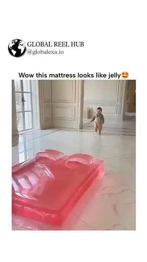 GLOBAL REEL HUB | The post features a 70-second AI-generated video showcasing translucent, wobbling "jelly" mattresses in vibrant colors, with toddlers... | Instagram