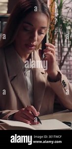 Caucasian business woman talking mobile phone call typing laptop writing notes multitasking occupation at office table female girl worker businesswoman multitask work in company talk smartphone write Stock Video Footage - Alamy
