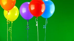 Flying balloons on green screen