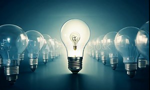 One of Lightbulb glowing among shutdown light bulb in dark area with copy space for creative thinking , problem solving solution and outstanding Stock Video