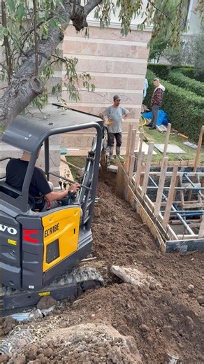 Mini Excavator Doing Backfill