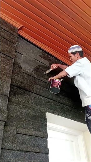 cleaning natural stone walls; using a mixture of water and floor cleaner.