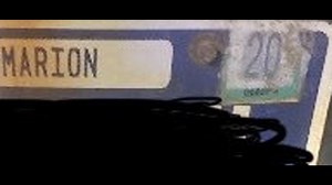 IMPD arrests woman with fake expiration sticker on license plate