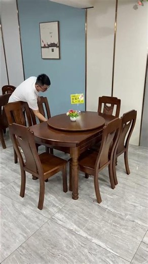 a solid wood round dining set, typically featuring an expandable or convertible top