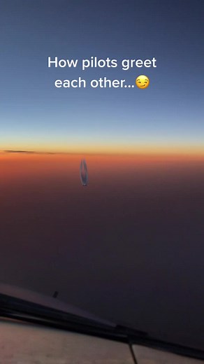 Pilots Greeting Each Other in the Sky