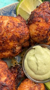 Make the best air fryer boneless chicken thighs with smoky blackened seasoning and refreshing avocado crema! | The Best Keto and Low Carb Recipes
