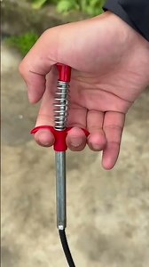 A trash picker for hard-to-reach waste is made from long wire cable, making cleaning much easier.