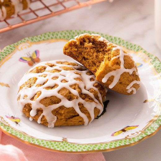 These super-soft and cakey pumpkin cookies filled with spices and drizzled with icing are a perfect melt-in-your mouth treat for fall. 🎃 | Preppy Kitchen