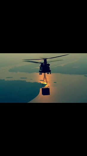 Helicopter Lifting Shipping Container Over Cityscapes