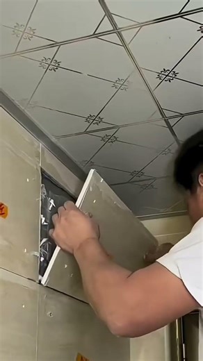 Installation of ceramic tiles on upper wall near ceiling #shorts