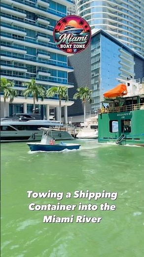 Watch This Tugboat Pull a Huge Shipping Container Entering the Miami River!